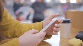 Young woman using smartphone at mall. Caucasian girl looking at mobile phone. Communication, work or study, connection, mobile apps, technology, lifestyle concept 4K - Powered by Shutterstock - Get 15% off with code: PIKWIZARD15