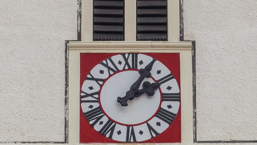 Clock on tower of St. Mark Church at St. Mark Square timelapse. Zagreb, Croatia. Close up view to watch face