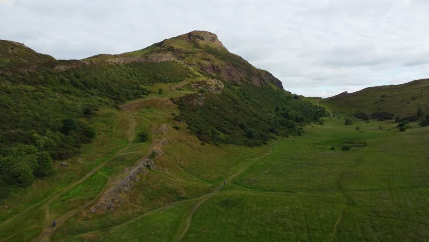 AERIAL: Holyrood Park in a summer day. Edinburgh, Scotland.