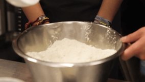 Following Close Up Shot of A Chef Teaching an Apprentice to Make Cake Batter - Powered by Shutterstock - Get 15% off with code: PIKWIZARD15
