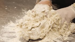 Following Close Up Shot of The Cook Showing the Apprentice How to Knead the Dough - Powered by Shutterstock - Get 15% off with code: PIKWIZARD15