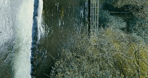 The rapid waters of the stream contrast the stillness of the surrounding greenery. Kilbrittain Woods. Vertical video. pano