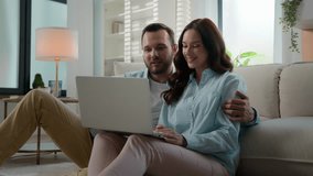 Caucasian couple using laptop choose goods buying clothes online web store choosing together travel tour planning vacation trip order booking hotel man and woman at home computer internet shopping - Powered by Shutterstock - Get 15% off with code: PIKWIZARD15