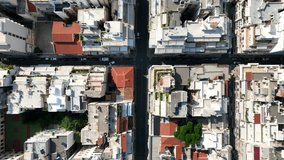 Aerial drone cinematic top down pan video of Athens historic centre dense urban cityscape, Attica, Greece