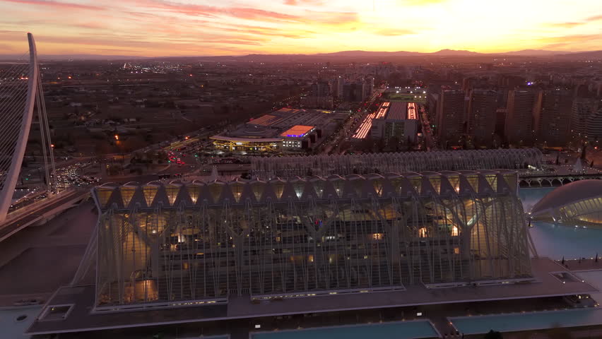 Aerial shot of Valencia iconic city a breathtaking twilight sky, with a warm glow over the horizon. Slow Motion, Camera 4K RAW. 