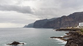 View from the south of the cliffs of Acantilados de Los Gigantes on Tenerife island on a cloudy day - timelapse video