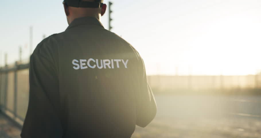 Security guard, radio and back of man on patrol outdoor for inspection, investigation and search. Surveillance, law and person with walkie talkie for safety, communication and protection service Royalty-Free Stock Footage #3424006847