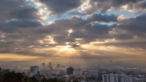 Sunrise over Los Angeles cityscape. Zoom in on downtown. Timelapse.