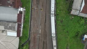 drone view of Malang City train station, East Java, Indonesia in the morning with several trains lined up there