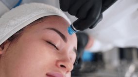Skincare specialist performs hydrafacial treatment on client. Hydro dermabrasion technique cleanses, exfoliates, extracts, hydrates skin. Beauty spa offers anti-aging facial rejuvenation services. - Powered by Shutterstock - Get 15% off with code: PIKWIZARD15