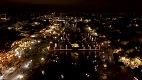 River Boats in Hoi An Old Town at Night. Vietnam. 4k Aerial Drone Footage