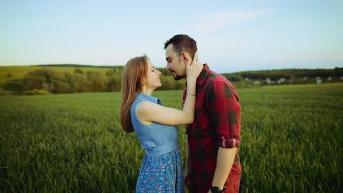 Sweet romantic couple cuddling and kissing passionately. True feelings, happy together, playful mood. Positive emotions, family. Just married, couple goals