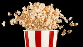 Super Slow Motion of Exploding popcorn from Bucket. Composite Shot. Isolated on Black Background. Studio Shot of Flying Food. Filmed on High Speed Cinema Camera, 1000fps. Speed Ramp Effect. - Powered by Shutterstock - Get 15% off with code: PIKWIZARD15