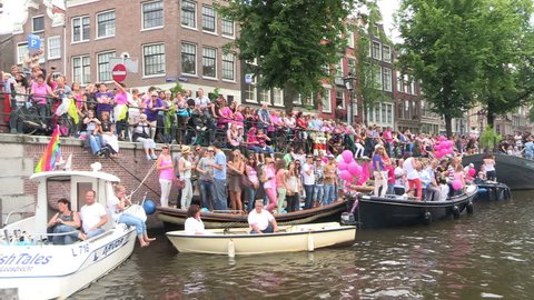AMSTERDAM, HOLLAND - AUGUST 4: Gay Pride Canal Parade Amsterdam 2012 filmed from one of the parading boats - August 4, 2012 in Amsterdam, the Netherlands.