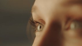 Close-up portrait of a young attractive woman opening her eyes and smiling - Powered by Shutterstock - Get 15% off with code: PIKWIZARD15