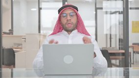 Online Video Talk via Laptop by Young Muslim Man