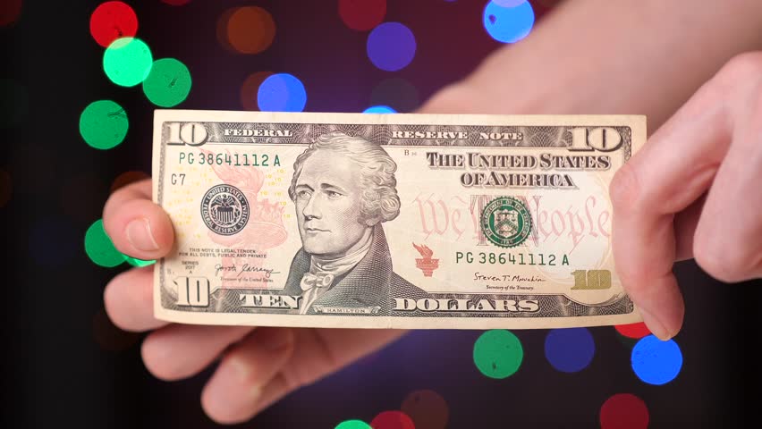 close-up 10 ten dollar paper bill in a woman's hand Royalty-Free Stock Footage #3424457723