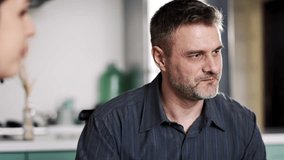 Happy father smiling and looking at daughter and wife. Satisfied daddy listen how his schoolgirl joking. Man satisfied talking at dining room with family indoors - Powered by Shutterstock - Get 15% off with code: PIKWIZARD15