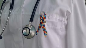 World Autism Awareness and Pride Day with ribbon with puzzle pattern. Autism causes symptoms of disease - Powered by Shutterstock - Get 15% off with code: PIKWIZARD15