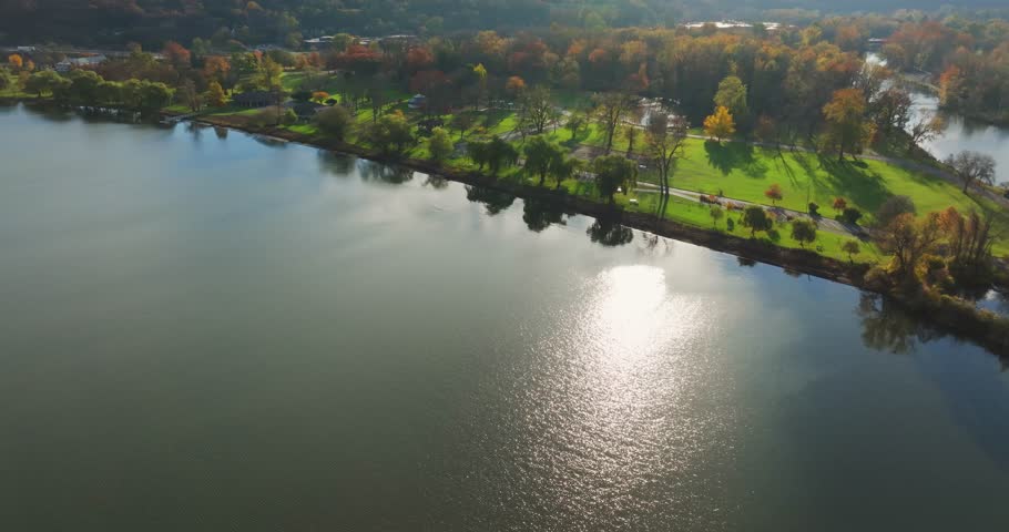 Fall, autumn, drone aerial videos with view of Stewart Park at the south end of Cayuga Lake, Ithaca New York.  11-03-2024