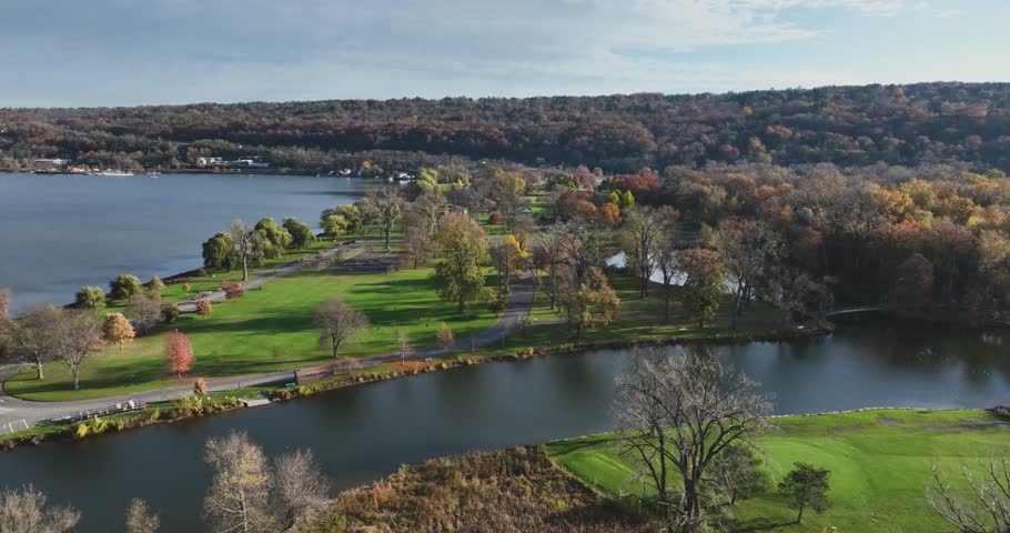 Fall, autumn, drone aerial videos with view of Stewart Park at the south end of Cayuga Lake, Ithaca New York.  11-03-2024