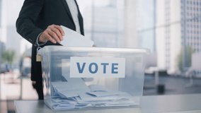 Concept of Ballot Stuffing: Electoral Fraud Threatening Democratic Process and Fair Political System. Diverse Voters Casting Their Vote at a Polling Place and Putting Ballots into a Sealed Box. - Powered by Shutterstock - Get 15% off with code: PIKWIZARD15