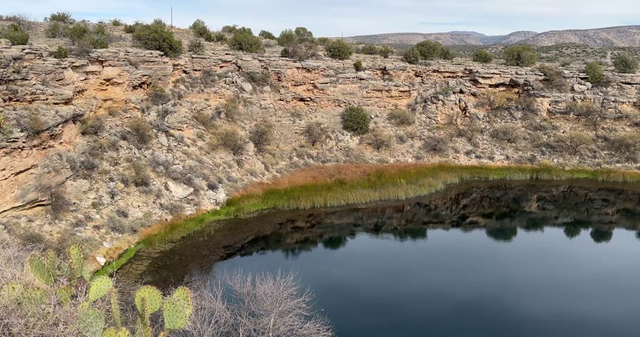 Montezuma Well is a natural limestone sinkhole near the town of Rimrock, Arizona, part of Montezuma's Castle National Monument Royalty-Free Stock Footage #3424604087