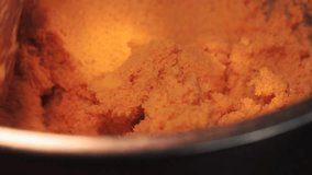 4k video detail of hands mixing butter and flour. Food preparation concept.