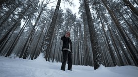 Man raps in winter forest. Media. Stylish man moves in hip hop style in winter forest. Man reads hip hop in winter forest