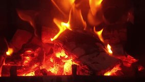 Relaxing fire in the fireplace. Cozy Relaxing Fireplace. TV Screen Saver. A Looping Clip of a Fireplace with Medium Size Flames Christmas Holidays Concept. Close-up, flames from fire. 
