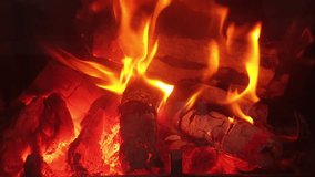Relaxing fire in the fireplace. Cozy Relaxing Fireplace. TV Screen Saver. A Looping Clip of a Fireplace with Medium Size Flames Christmas Holidays Concept. Close-up, flames from fire. 