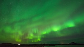 ICELAND – 2016 : Timelapse of amazing Northern Lights at Lake Myvatn at night with beautiful landscape in view