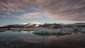 ICELAND – 2016 : Timelapse of Glacier Lagoon / Jökulsarlón at sunrise with icebergs and clouds in view