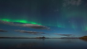 ICELAND – 2016 : Timelapse of amazing Northern Lights at Lake Myvatn at night with beautiful landscape in view