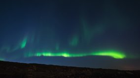 ICELAND – 2016 : Timelapse of amazing Northern Lights at Gódafoss waterfall at night with beautiful landscape in view