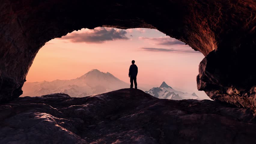 Adventurous Man Hiker standing in a cave with dramatic cloud and snowy mountain view. Adventure Composite. 3d Rendering Peak. Aerial Image of landscape from British Columbia, Canada. Sunset, Sunrise. Royalty-Free Stock Footage #3424927917