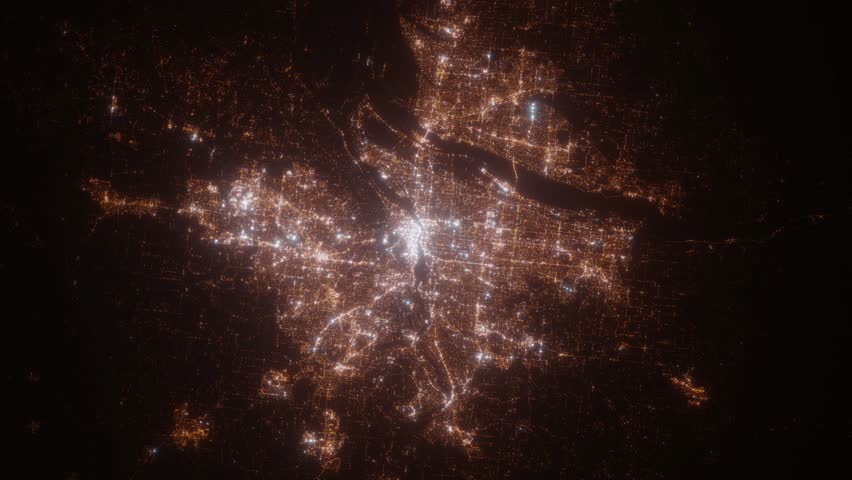 Portland (Oregon, USA) aerial view at night. Top view on city from space. Camera is zooming in, rotating clockwise