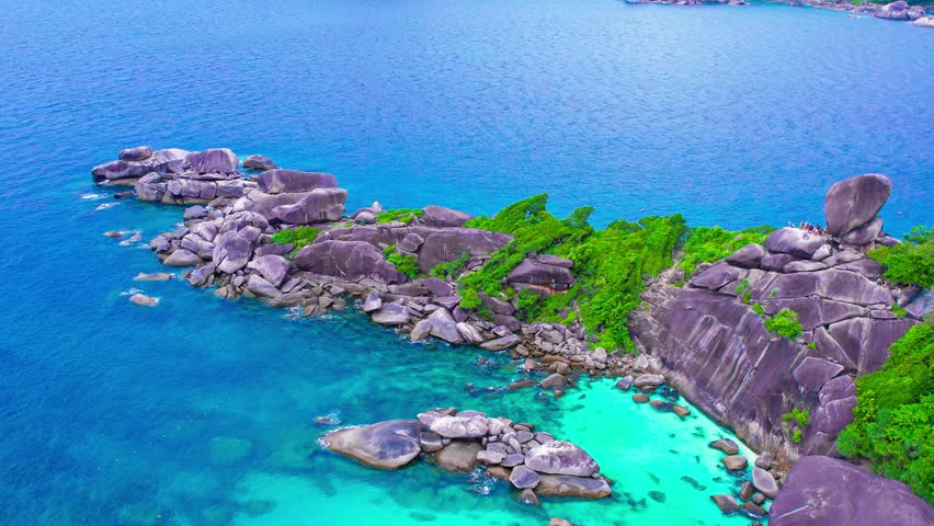 Aerial view of the Similan Islands, Andaman Sea, natural blue waters, tropical sea of Thailand. the beautiful scenery of the island is impressive. Royalty-Free Stock Footage #3425003213