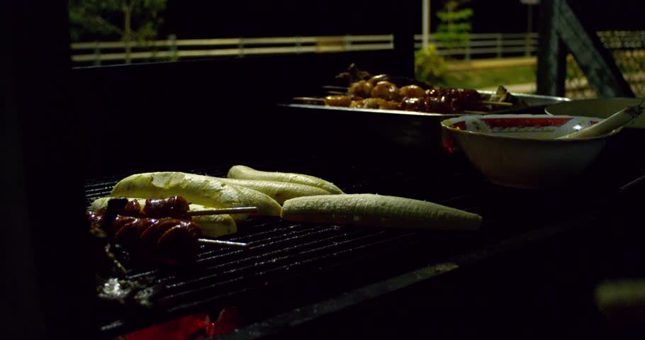 Scene of a man grilling banana in a delicious way.
