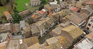 Aerial view cityscape Sutri Italy. Ancient streets with old houses, historical architecture and beautiful landscape. High quality 4k footage