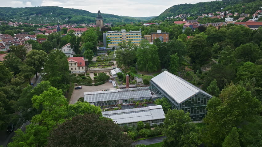 Aerial drone view of Botanical Garden ( Botanischer Garten ) in Jena , Thuringia, Germany . The Botanischer Garten Jena is the second oldest botanical garden in Germany . Royalty-Free Stock Footage #3425152563