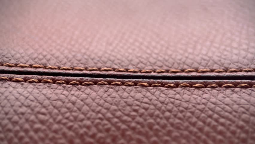 Seam On Brown Leather Background