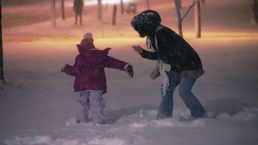Mother Playing with Her Daughter on the Snow at Night. Young Mother Chases Daughter. Happy Family Moment Royalty-Free Stock Footage #3425185927