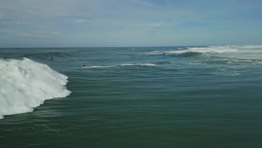 Atlantic ocean big waves, surfers and jet skis