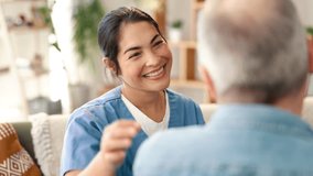 Happy woman, doctor and consulting in elderly care, support or trust for healthcare advice or comfort at old age home. Female person, caregiver or nurse talking with empathy to patient in living room - Powered by Shutterstock - Get 15% off with code: PIKWIZARD15