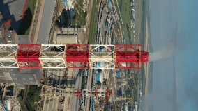 Aerial around view oil and gas refinery plant, Business petrochemical industrial, power and fuel energy, Ecosystem and healthy environment concepts. Vertical video