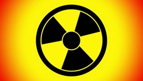 Spinning a radiation warning symbol. 4k Looping footage.