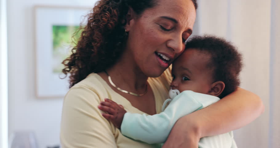 Comfort, bonding and mother holding baby with pacifier for calming with love and care at family home. Trust, embracing and closeup of mom carrying sweet boy infant, child or newborn in modern house.