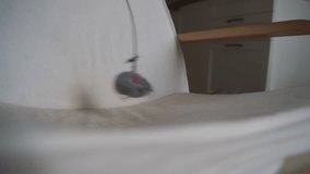 Grey tabby cat playing at home with toy mouse on rope. Pet activities  - Powered by Shutterstock - Get 15% off with code: PIKWIZARD15