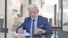 Old Businessman Doing Financial Calculations of Business Report - Powered by Shutterstock - Get 15% off with code: PIKWIZARD15